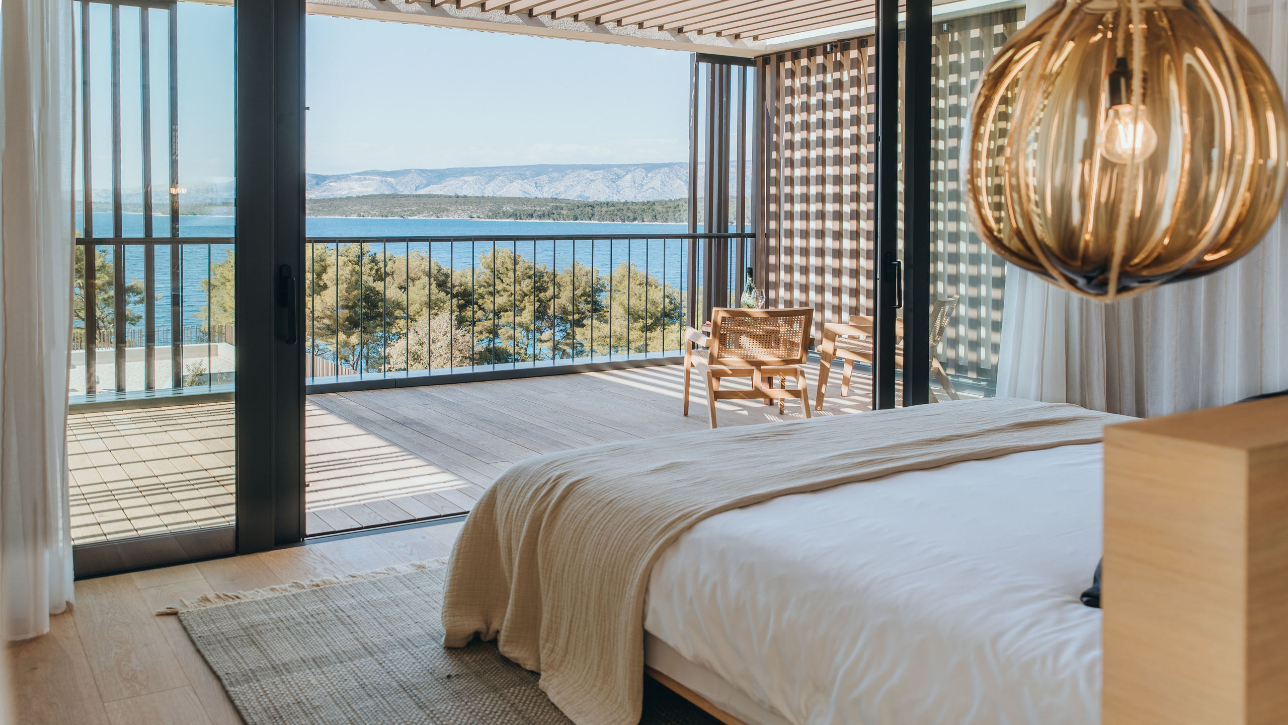 Maslina Resort in Hvar with floor-to-ceiling windows and sea-view luxury room