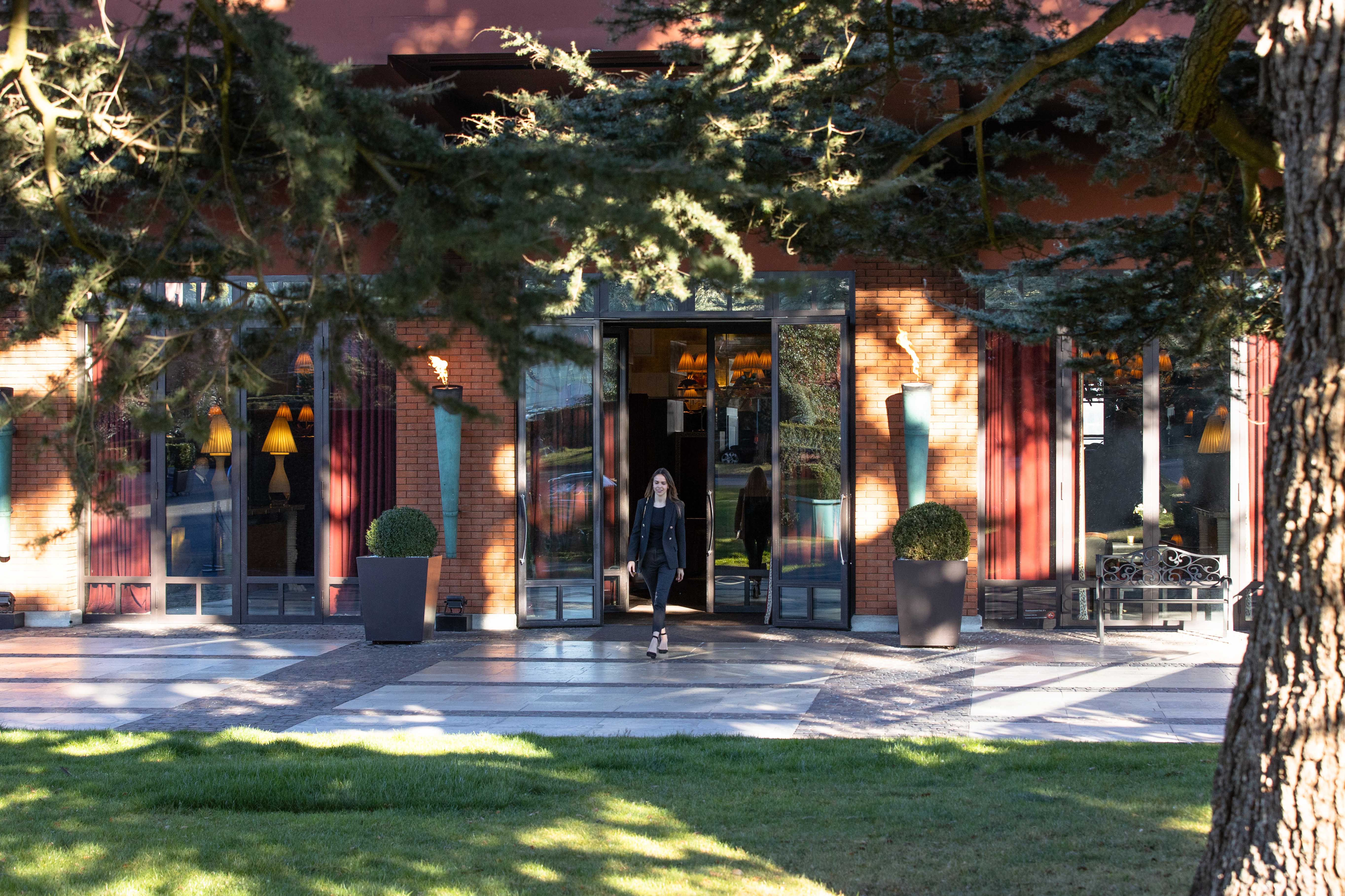 La Réserve Genève entrance exterior — contemporary lakeside palace set in private parkland, Geneva
